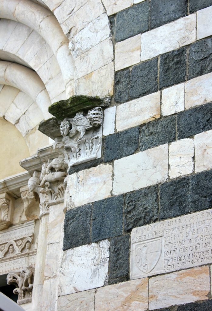 Detail on the side of the black and white church in Volterra near Villa Le Capanne in Tuscany - my review of the perfect big family villa in Tuscany, Italy