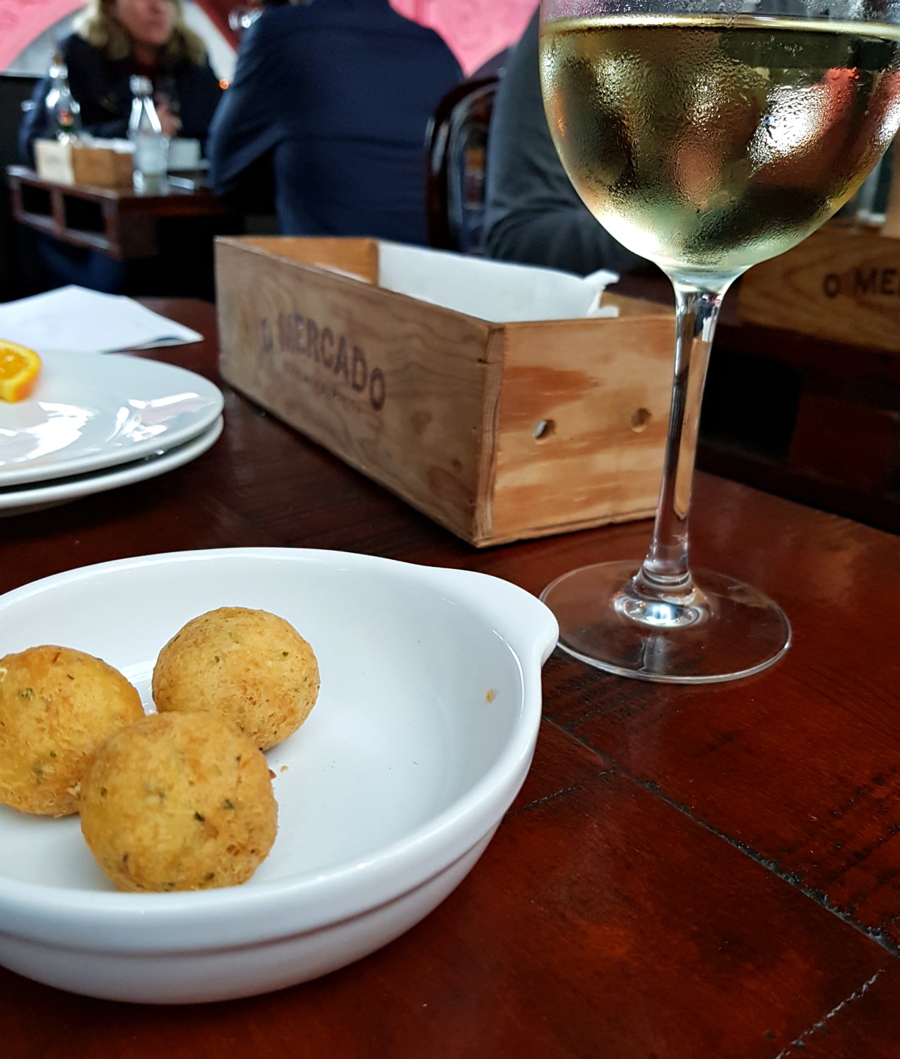 Bacalhau and wine to start one long lunch in a restaurant in Porto - my Porto travel tips and lessons for visiting the city with kids