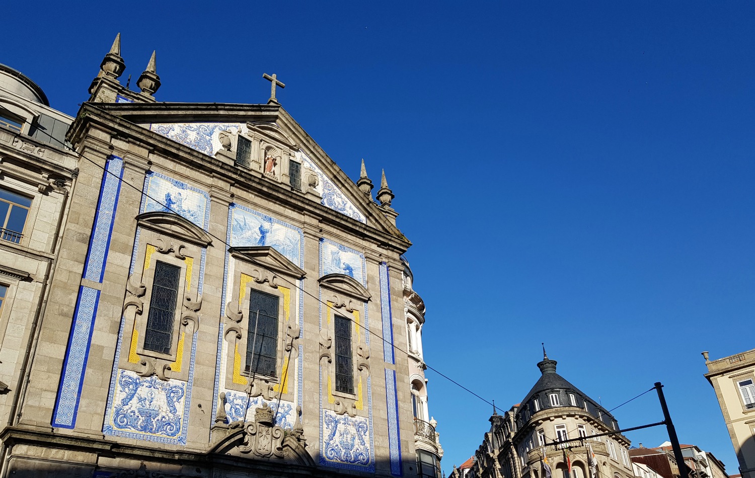 Tiled church against a blue sky in Porto - my Porto travel tips and lessons for visiting with kids