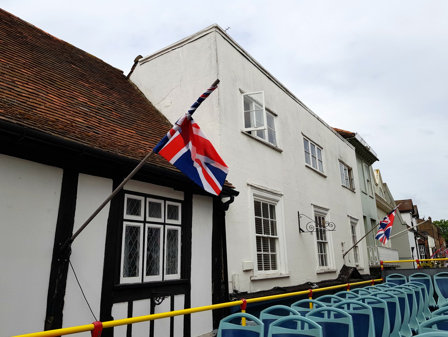 Flag flying on an old building in Eton - hopping on to the Windsor original tour, a Windsor bus tour with kids