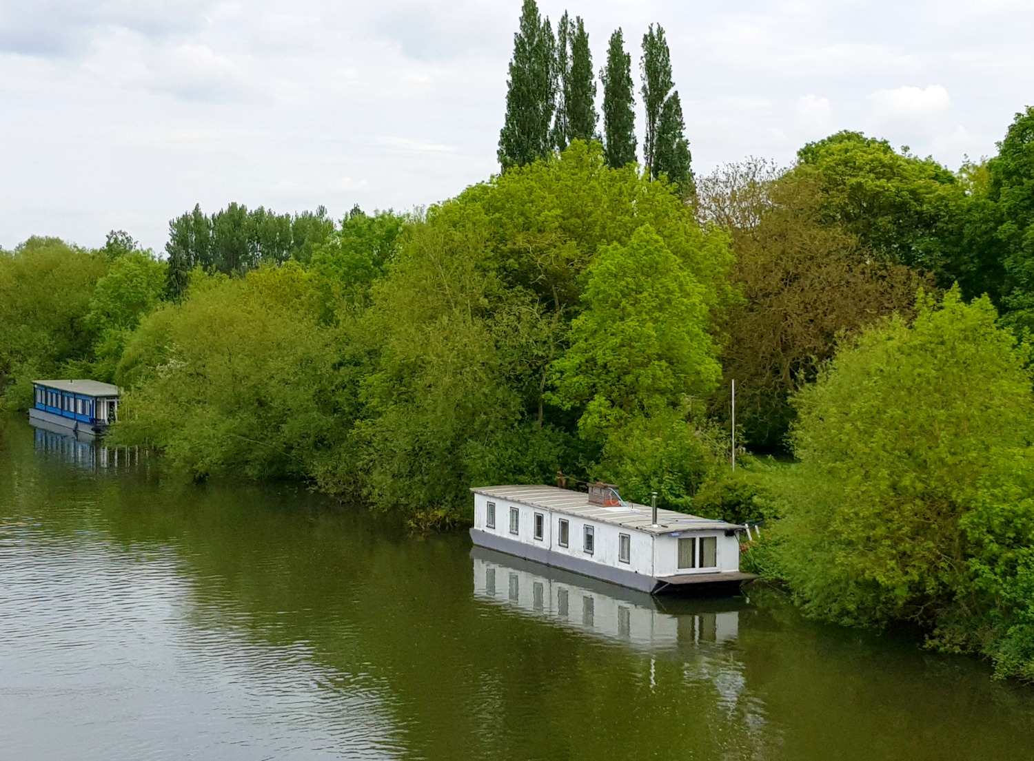 A view of a boat on the river Thames near Windsor - hopping on to the Windsor original tour, a Windsor bus tour with kids
