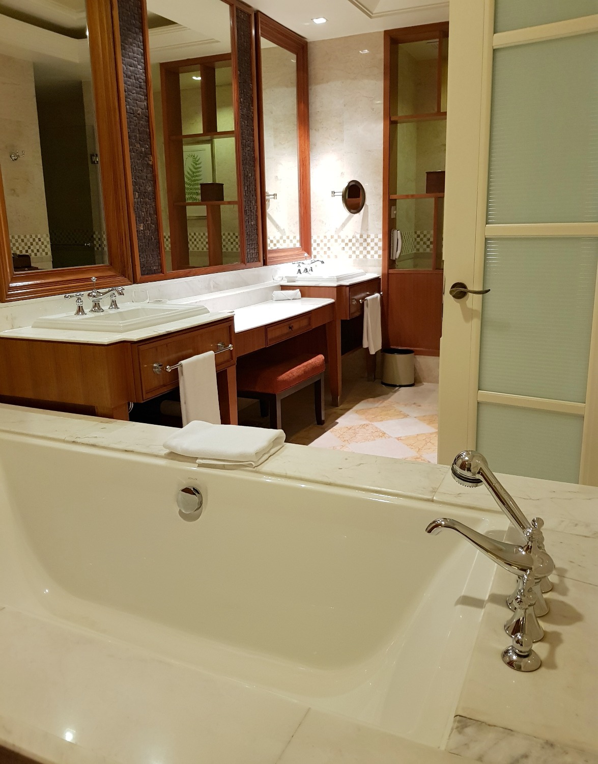 View from the bedroom into the bathroom across the tub at The Danna Langkawi - my Danna Langkawi review if you're visiting the luxury hotel in Malaysia with kids