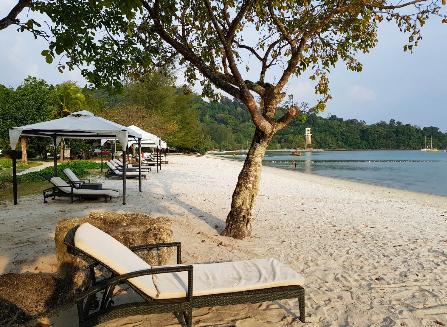 Loungers on the beach at The Danna Langkawi - my Danna Langkawi review if you're visiting the luxury hotel in Malaysia with kids