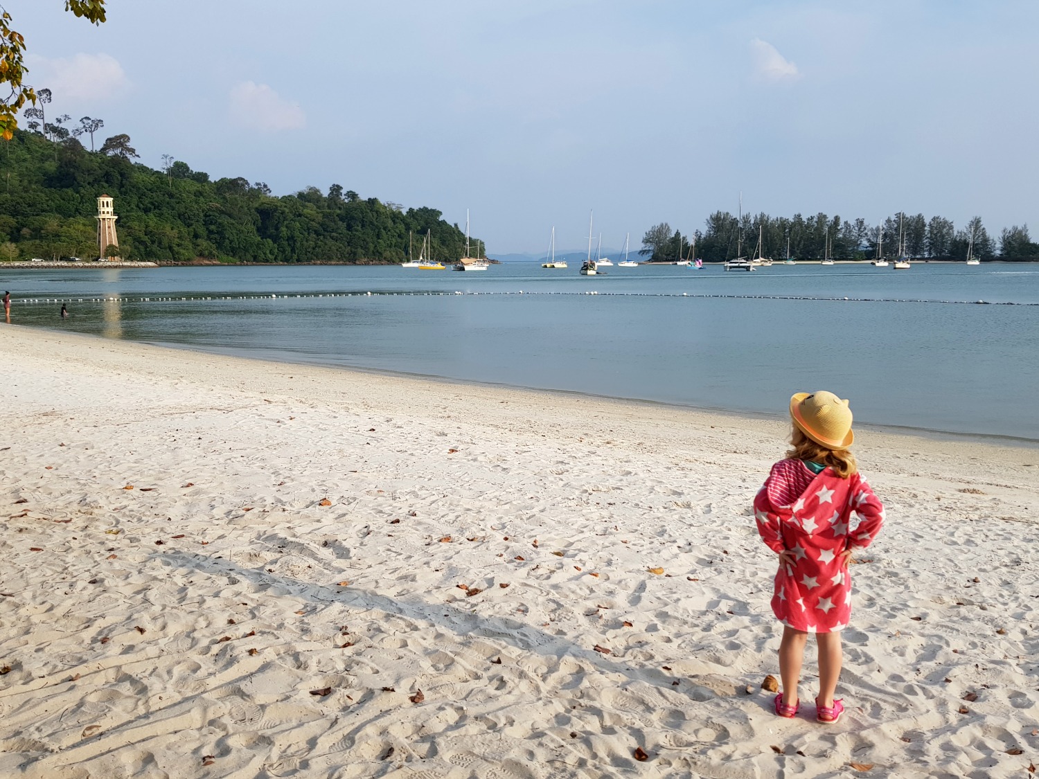 My daughter on the beachfront at The Danna Langkawi - my Danna Langkawi review if you're visiting the luxury hotel in Malaysia with kids