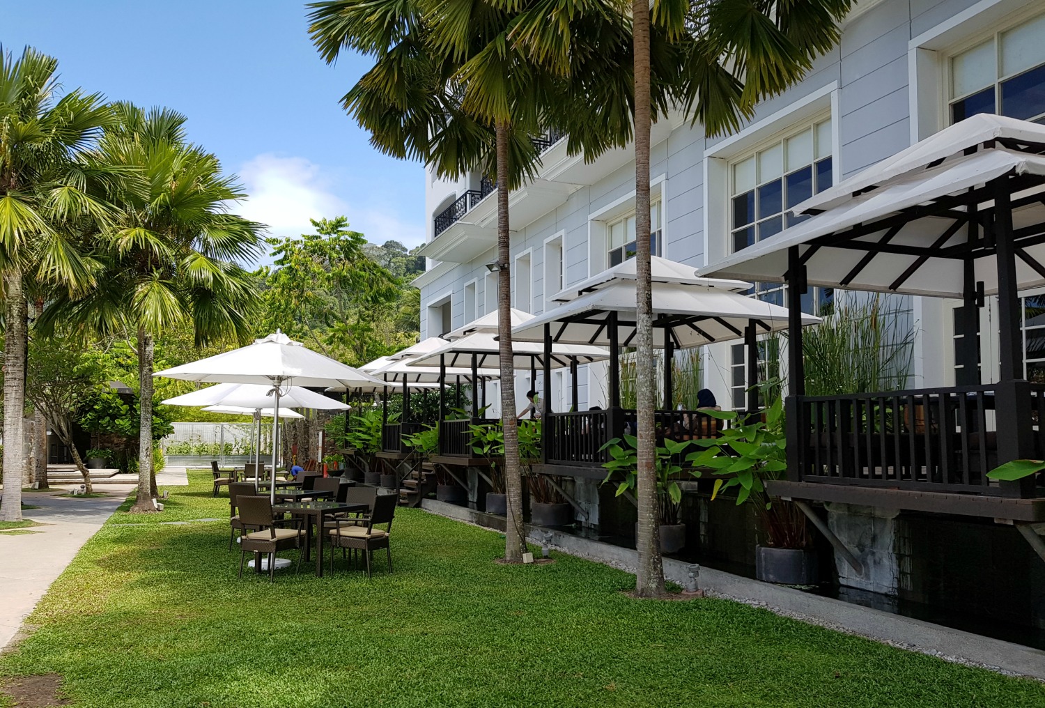 Tables outside The Planter's restaurant at The Danna Langkawi - my Danna Langkawi review if you're visiting the luxury hotel in Malaysia with kids