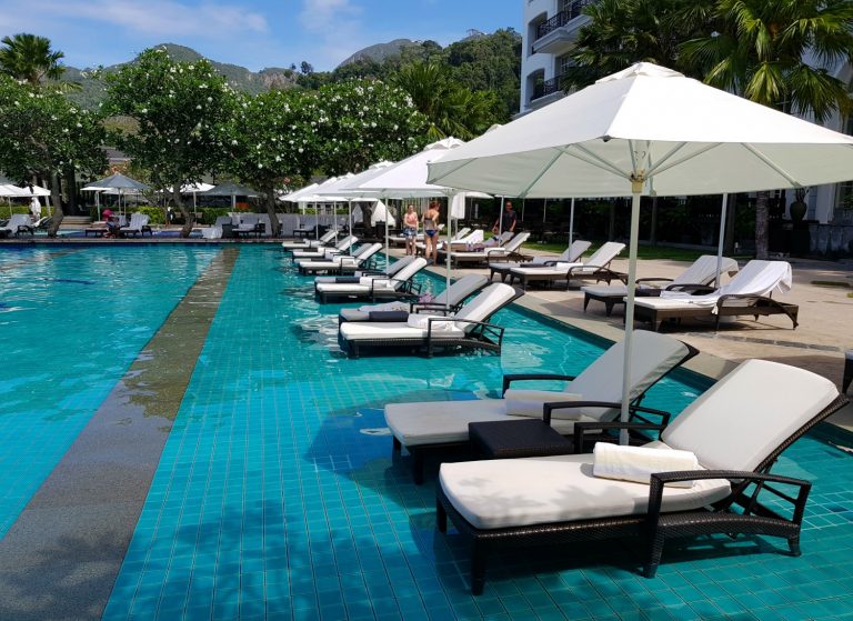 Loungers in the shallowest section of the infinity pool at The Danna Langkawi - my Danna Langkawi review if you're visiting the luxury hotel in Malaysia with kids