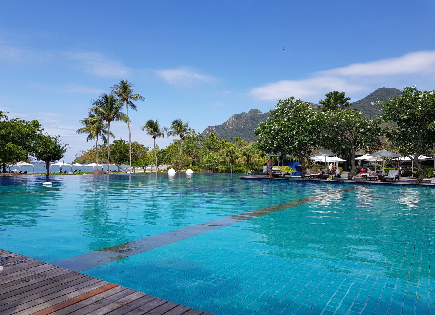 View across the stepped infinity pool at The Danna Langkawi - my Danna Langkawi review if you're visiting the luxury hotel in Malaysia with kids