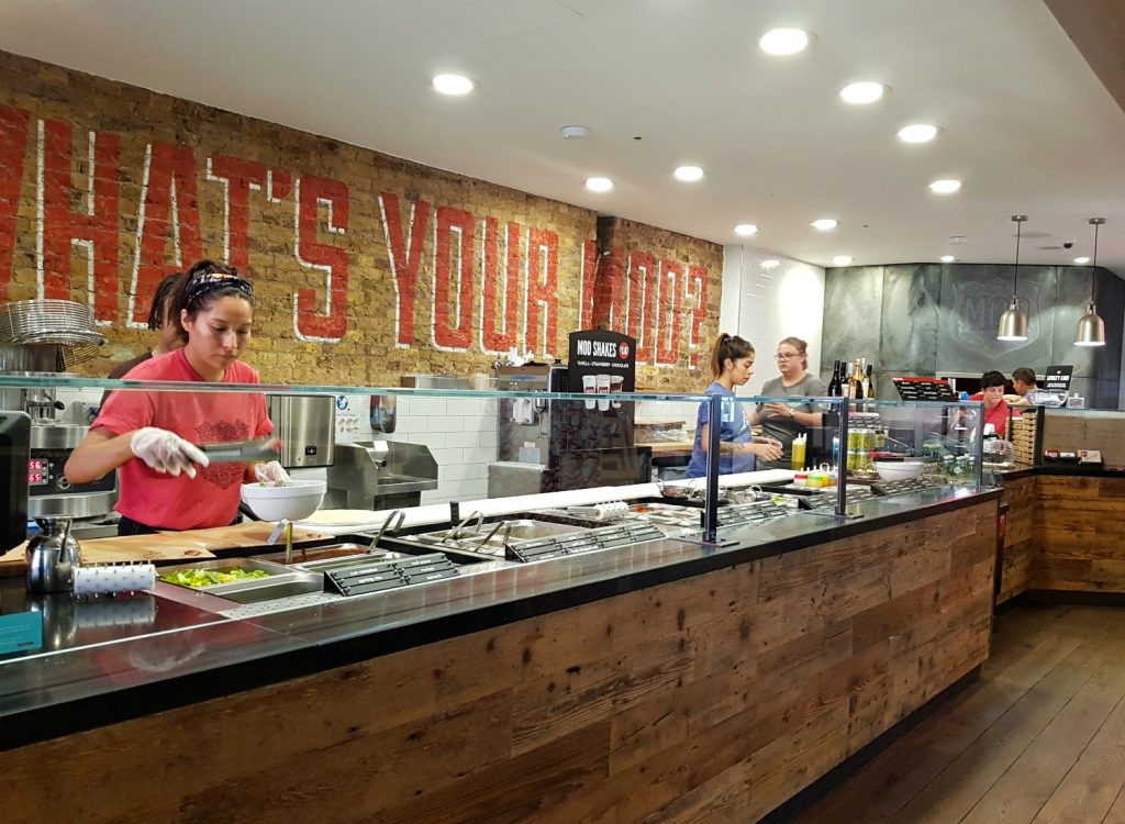 Inside MOD Pizza customising our food - the restaurant near Leicester Square has deals for Kids Week London 2018, with discounts on children's tickets for West End shows