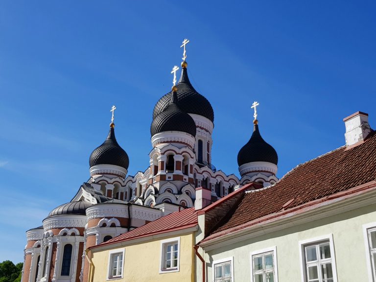 A view across buildings on Toompea Hill to the Alexander Nevsky cathedral - the city's famously fairytale architecture is just one of the many reasons to visit Tallinn, Estonia