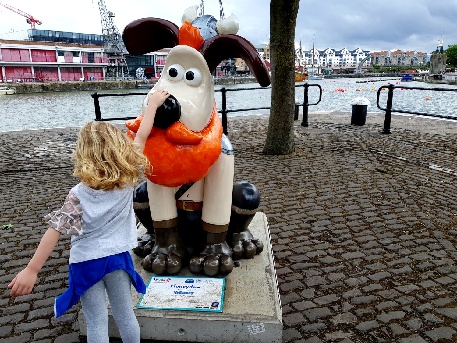 My daughter with Honeydew, aka the red bearded Viking Gromit - following the Gromit Unleashed 2 trail in Bristol, our review