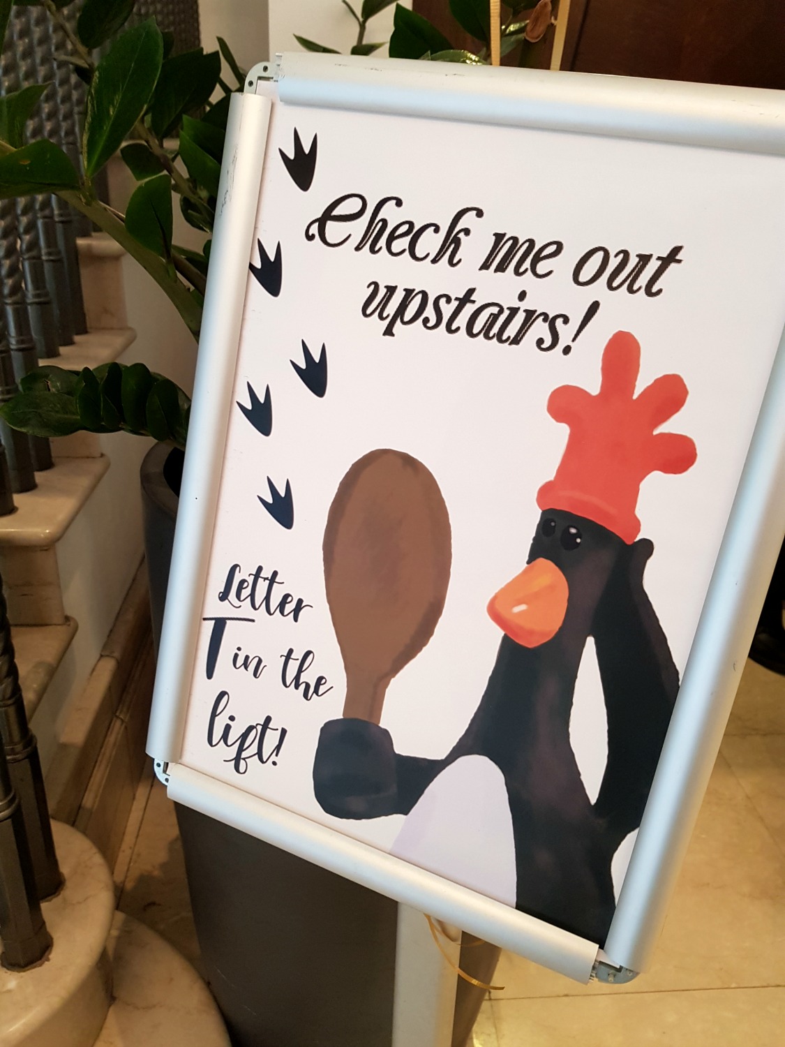 Sign for 'One in a minion' Feathers McGraw statue in the Bristol Marriott City Centre - following the Gromit Unleashed 2 trail in Bristol, our review