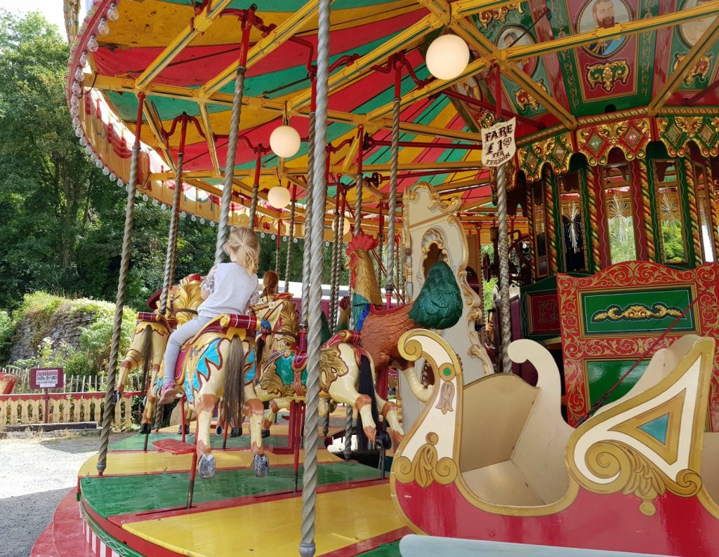 My daughter on the carousel at the Victorian Town open air museum - my Blists Hill review for the family-friendly attraction in Ironbridge Gorge, Shropshire