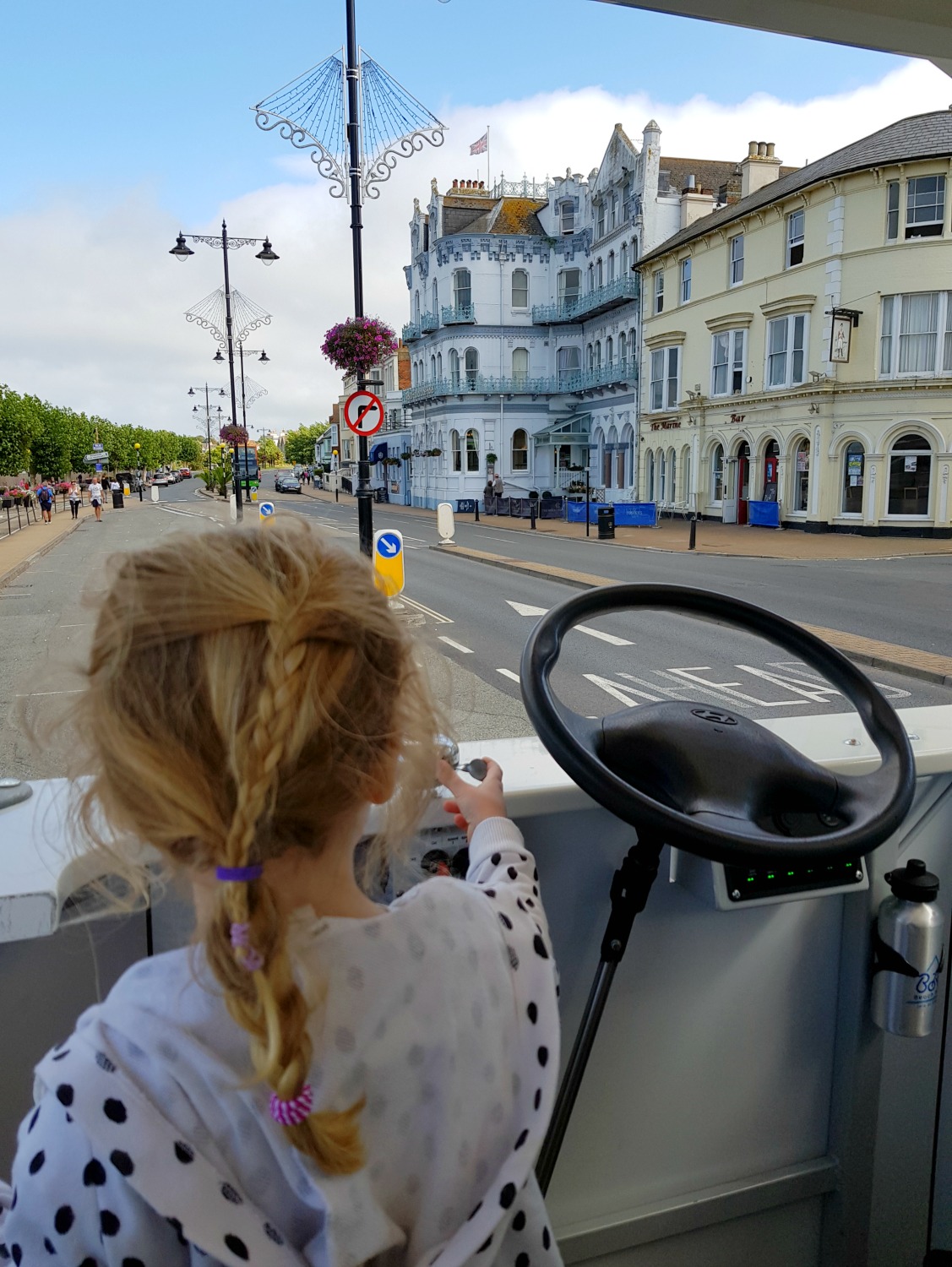 My daughter rings the bell of the BoRo bike as we make our way through Ryde - an Isle of Wight bear hunt, exploring the island in the footsteps of the famous children's book
