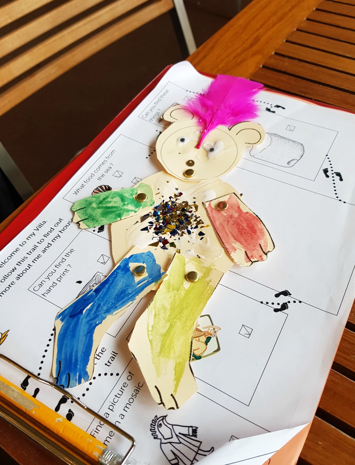 My daughter's decorated bear puppet on top of the activity trail sheet from Brading Roman Villa - an Isle of Wight bear hunt, exploring the island in the footsteps of the famous children's book