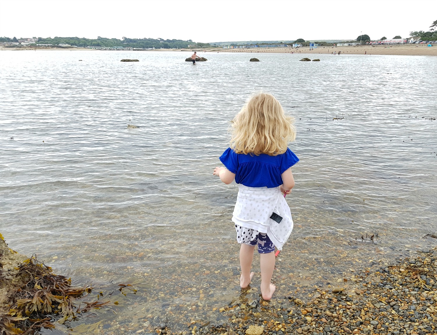 My daughter paddling and looking over to Priory Bay and St Helens Duver beyond - an Isle of Wight bear hunt, exploring the island in the footsteps of the famous children's book