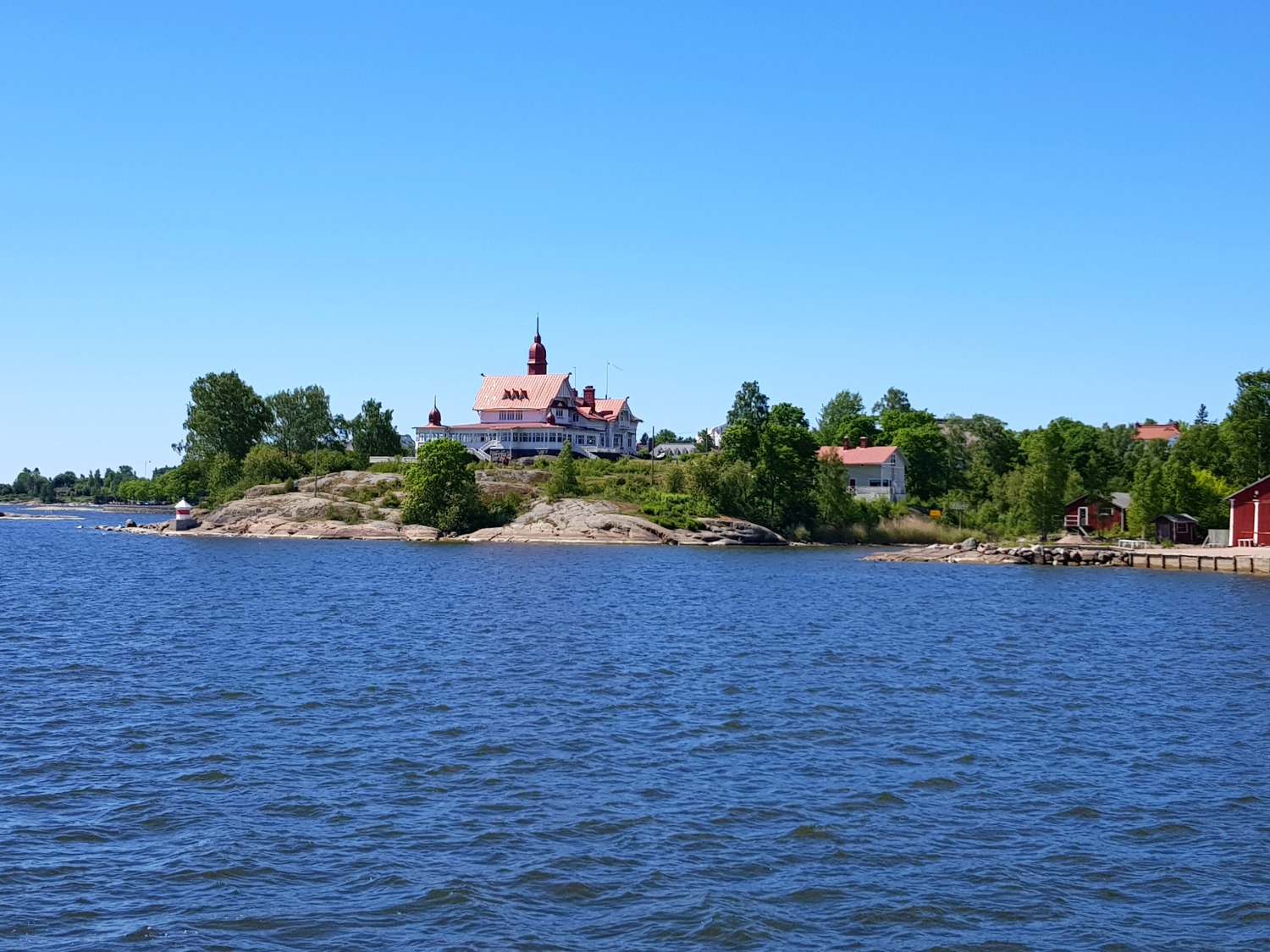 View across the sea to one of Helsinki's many islands - the chance to explore the archipelago is one of the top answers to the question why visit Helsinki?
