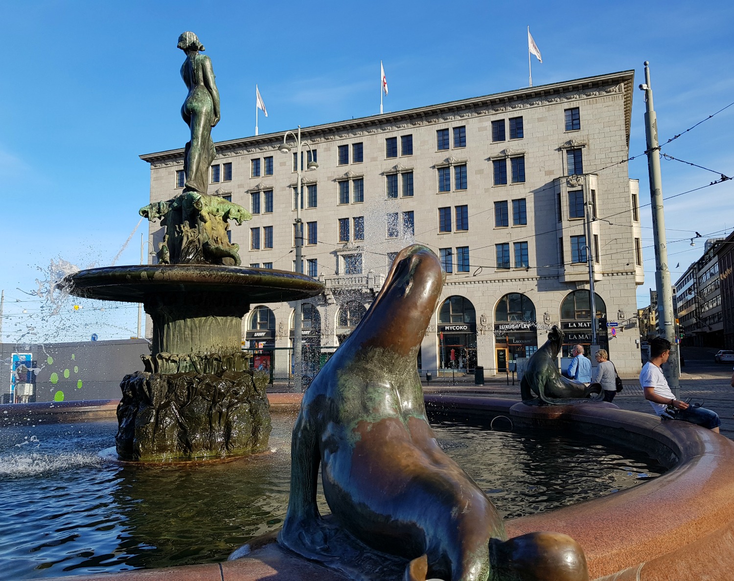 Sea lion statues around a fountain in Helsinki - the quirky side of the city is one of the top answers to the question why visit Helsinki?