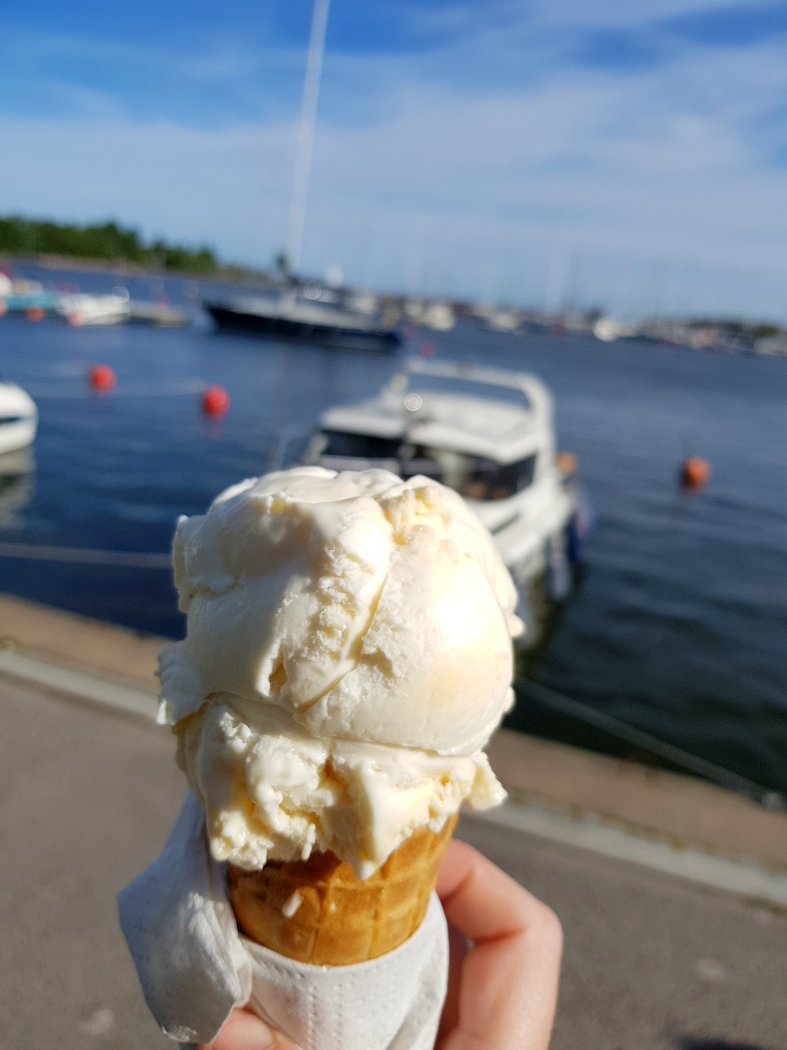Ice cream with the boats of the marina in the background. Why visit Helsinki? The atmosphere and chilled out feel makes it very attractive for a weekend break