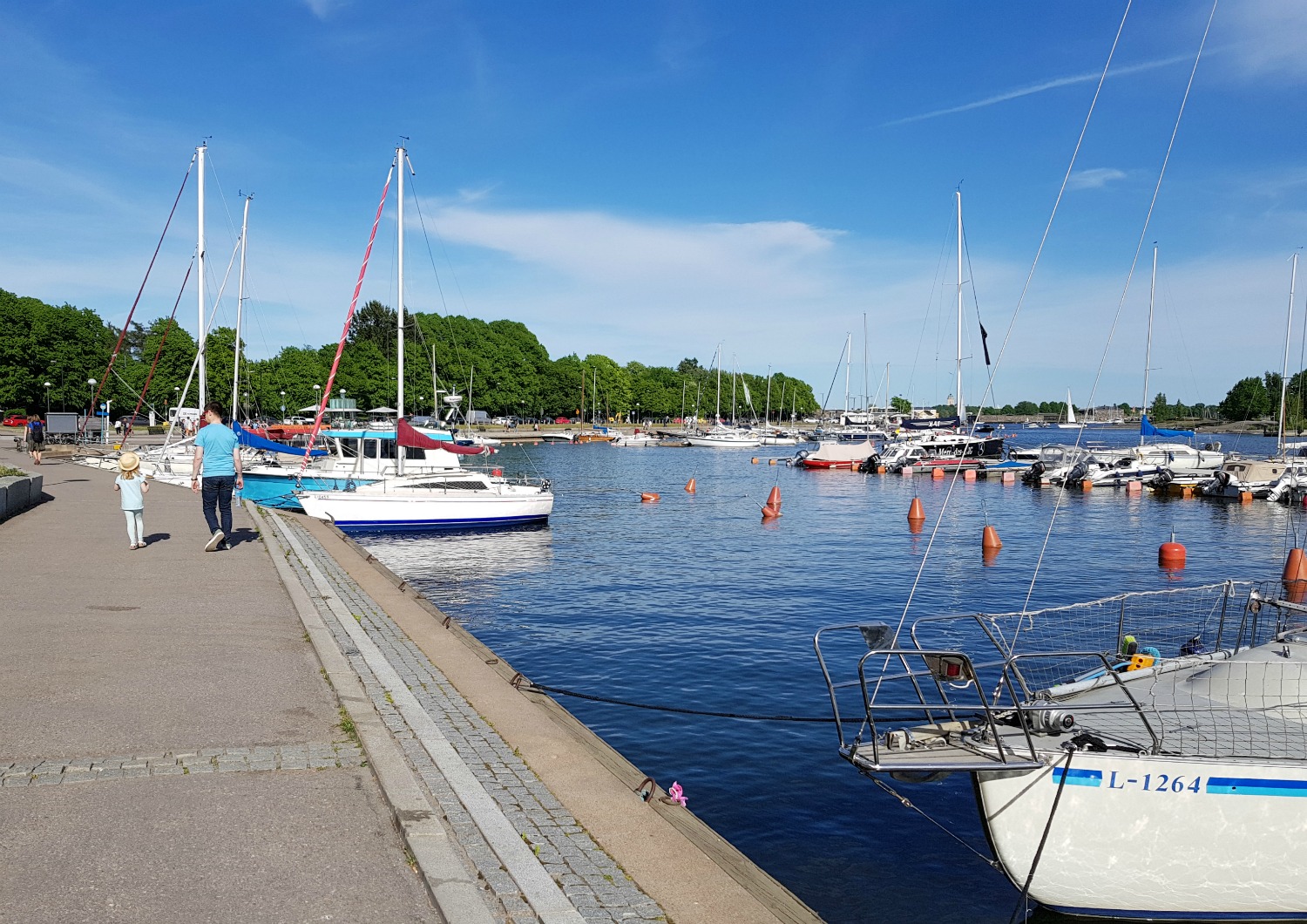 Boats moored on the waterfront at Helsinki - the chilled-out atmosphere is one of the top answers to the question why visit Helsinki?