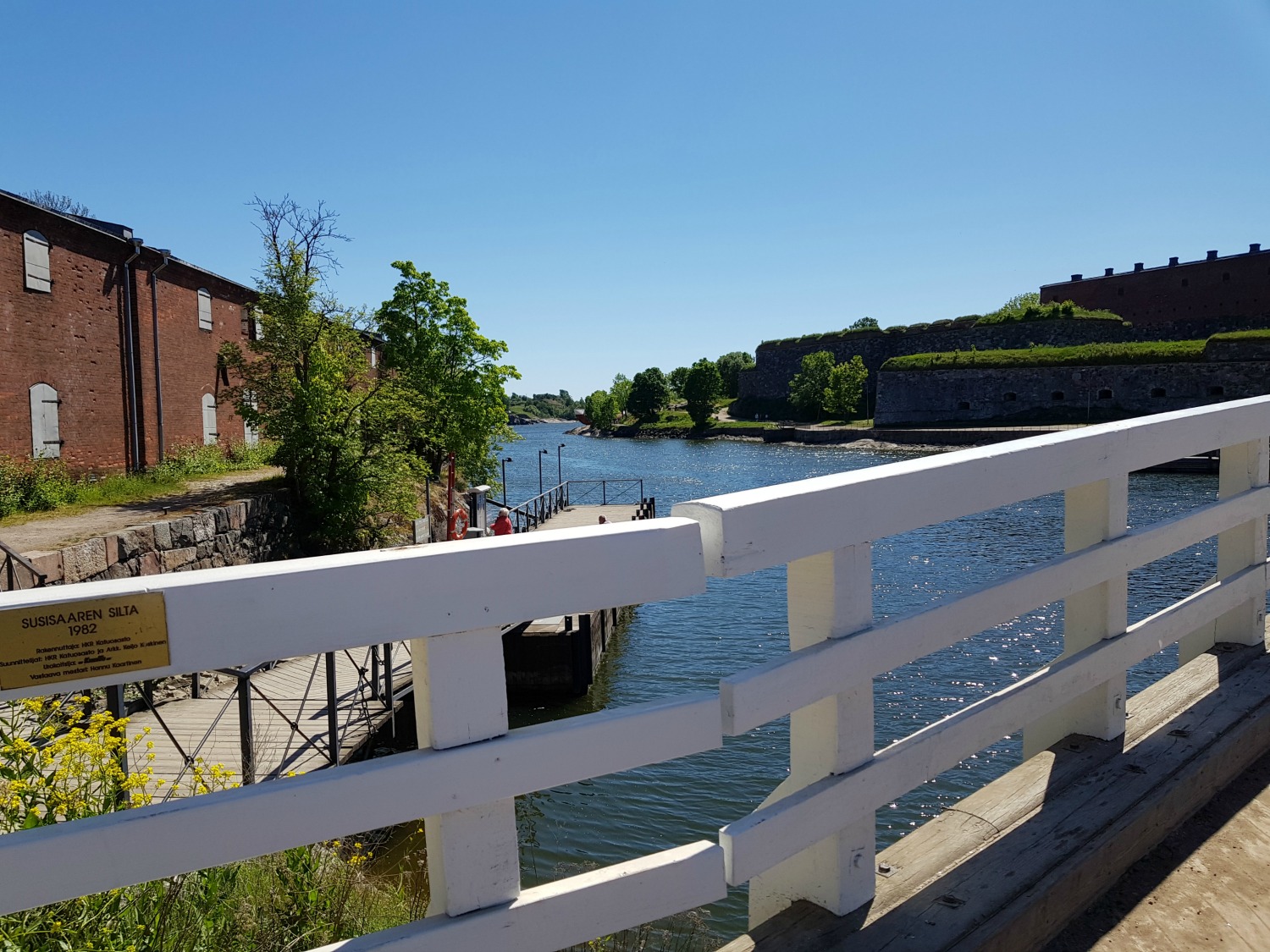 A view to the water across the bridge separating the two parts of Suomenlinna island in Helsinki - my tips on visiting Suomenlinna with kids