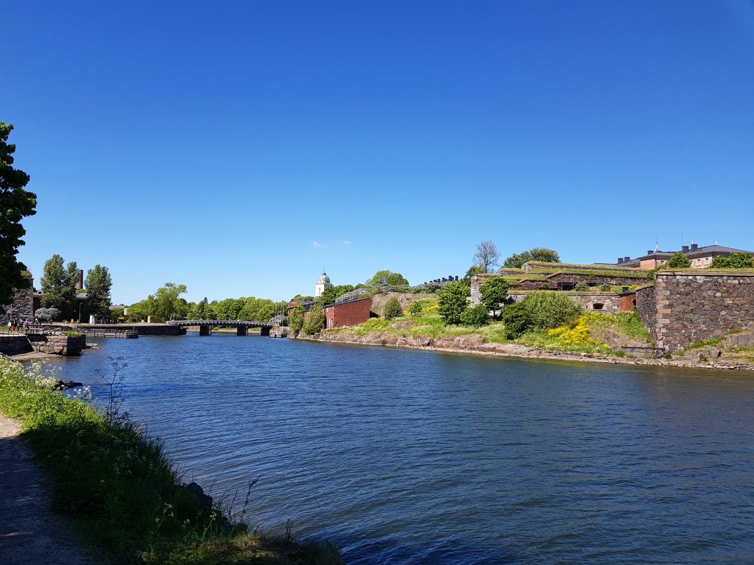 Looking out at the water separating the banks of Suomenlinna - my tips on visiting Suomenlinna with kids