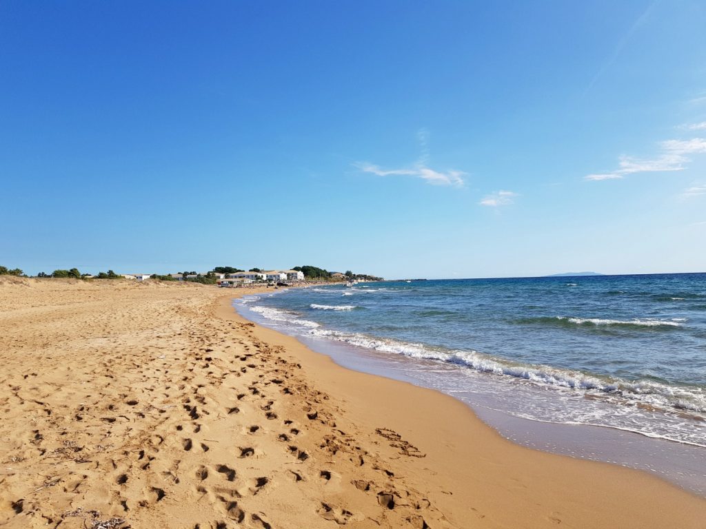 View along Agios Georgios South beach during our trip at half-term - plus my family travel essentials for the trip