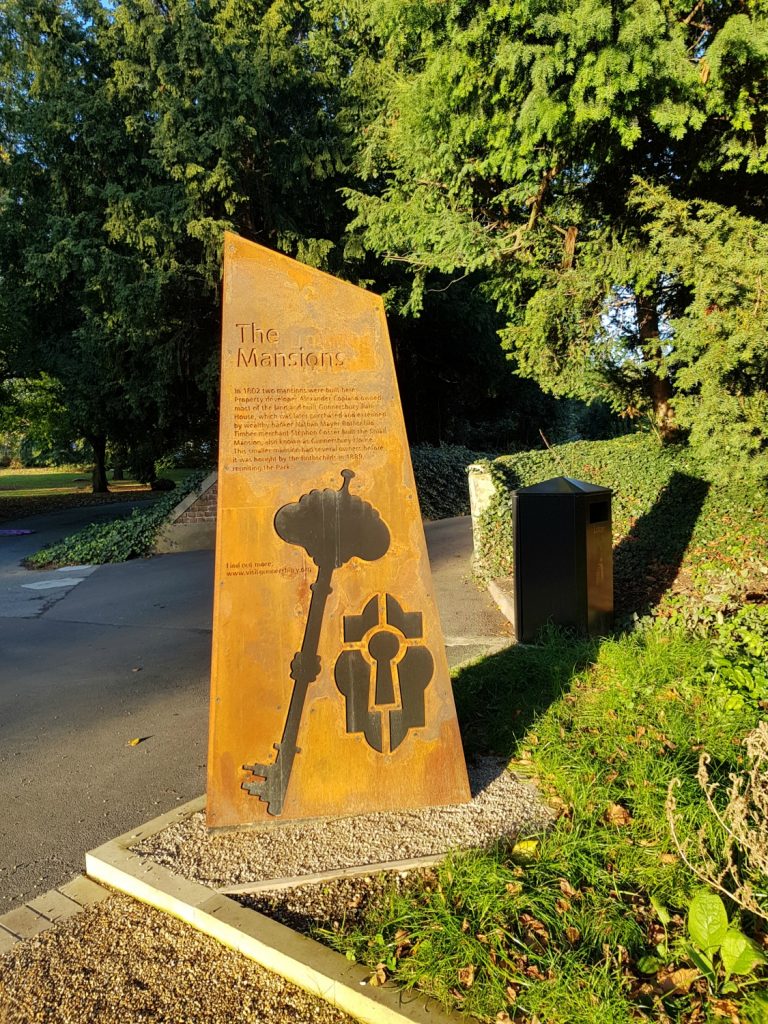 One of the signs dotted around the park for the museum, showing a cut-out lock and key - my review of a free day out in London, visiting Gunnersbury Park Museum with kids