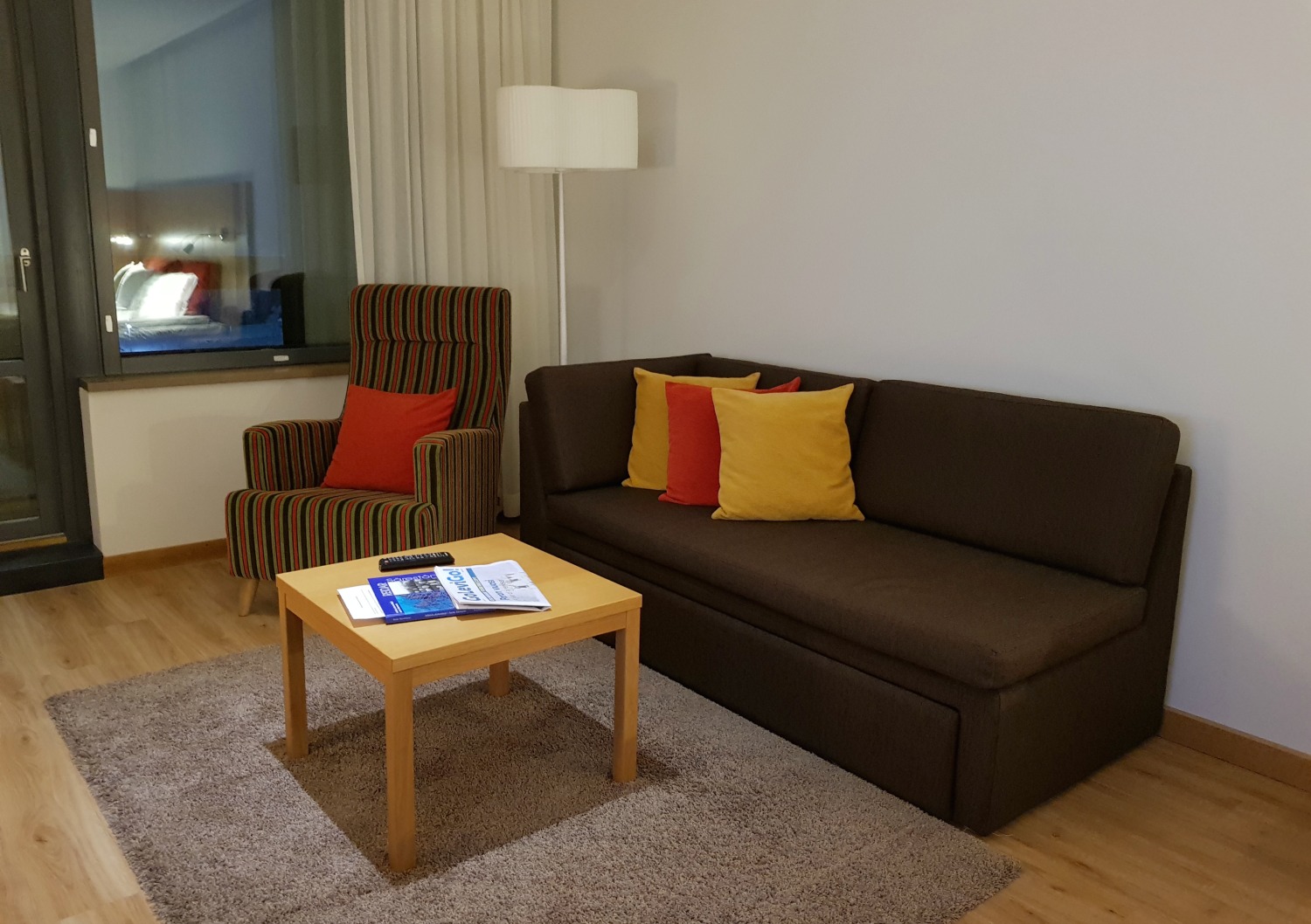 Sofa bed and chair plus table in the living area of our superior room - my review of Hotel Levi Panorama, Lapland