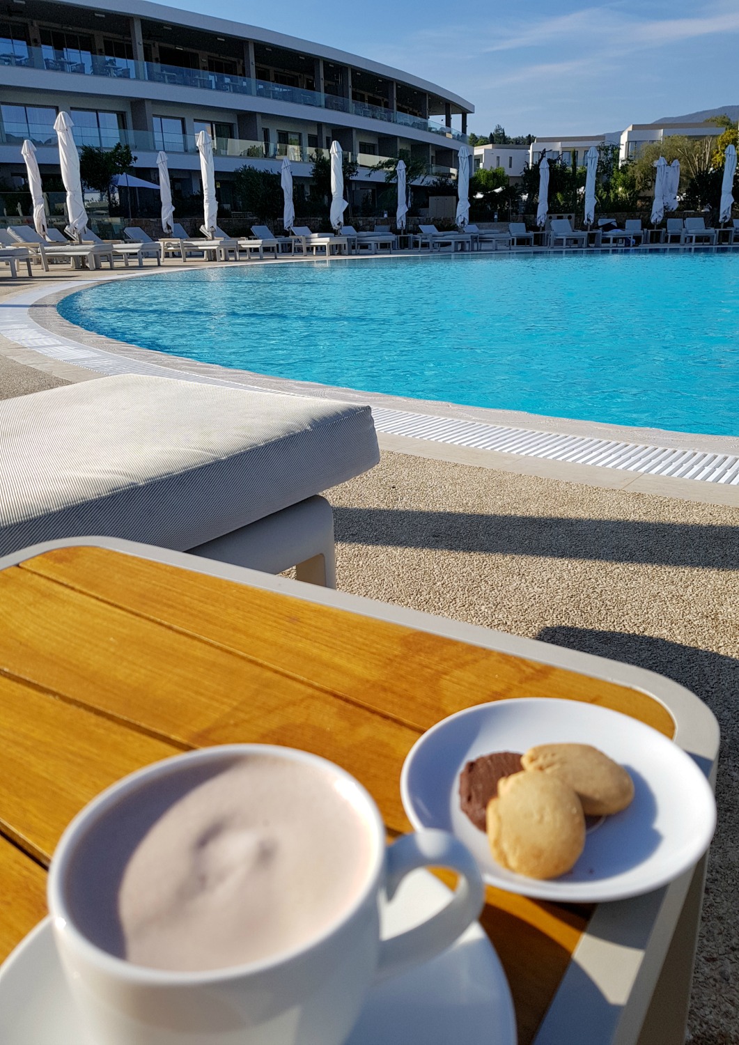Hot chocolate by the pool, brought by staff towards the end of the afternoon in case the October sun was chilly - my review of Ikos Dassia with kids, a family holiday in Corfu