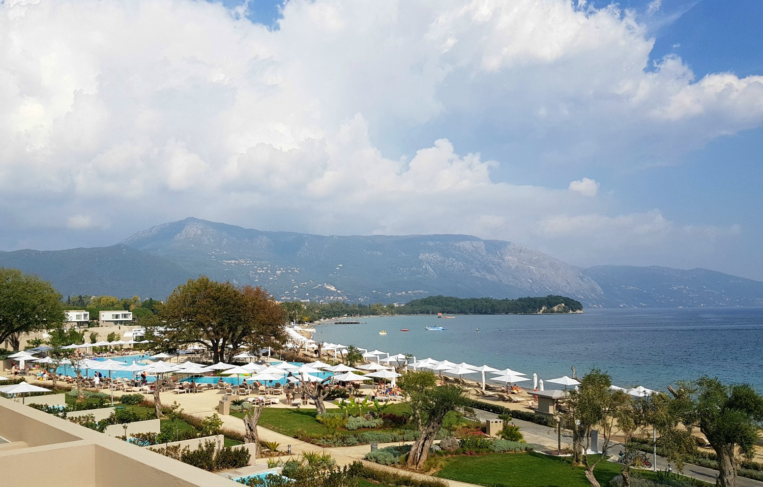 A view from the lobby at 'Sea' across the resort to the sea and hills - my review of Ikos Dassia with kids, a family holiday in Corfu