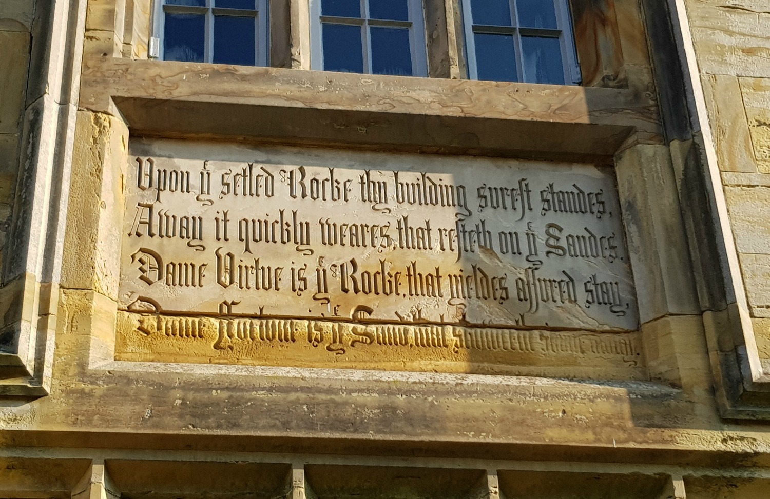 Carved motto on the front of the 19th century house at Scotney Castle, Kent - our winter day out at Scotney Castle with kids