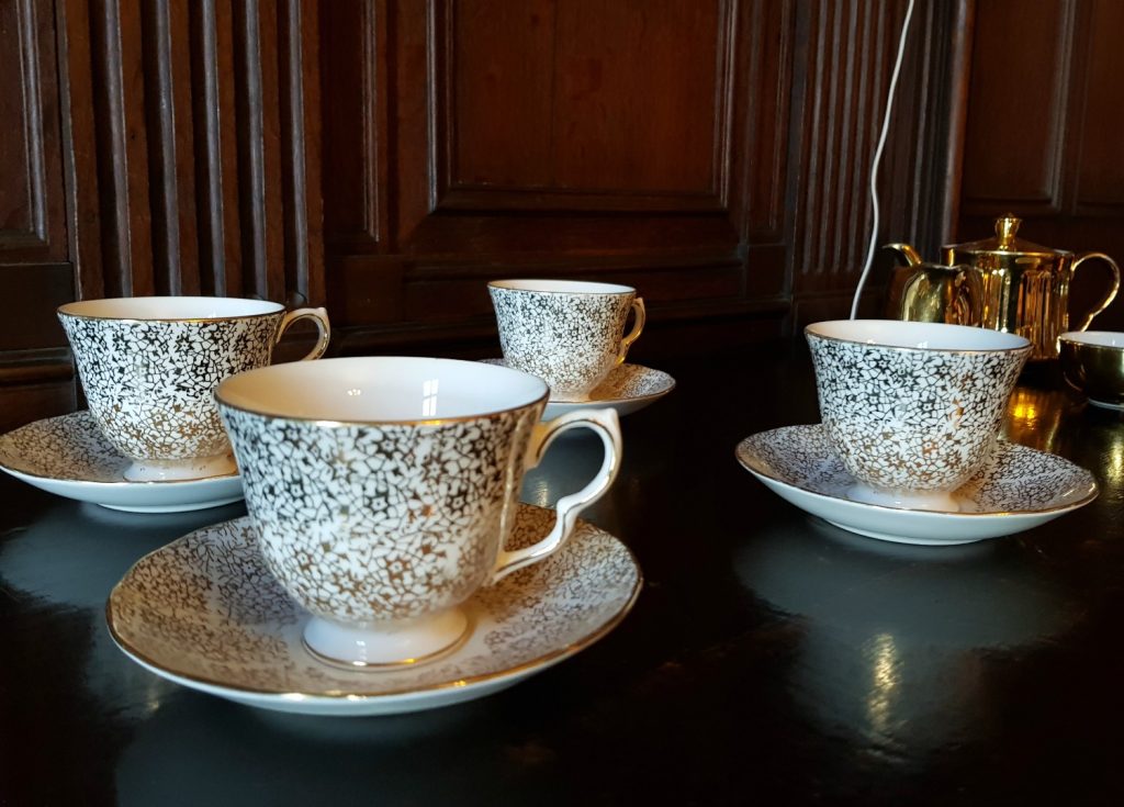 China with a silvery gilt pattern in the dining room of the 19th century house at Scotney Castle, Kent - our winter day out at Scotney Castle with kids