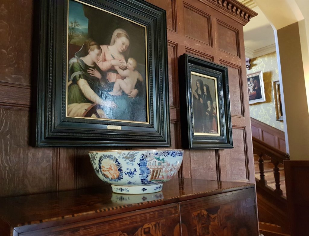 Painting and bowl against the wooden pannelling of the hall at the 19th century house at Scotney Castle, Kent - our winter day out at Scotney Castle with kids
