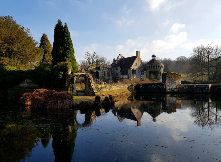Looking across the water to the ruins of the 14th century castle in Kent - our winter day out at Scotney Castle with kids