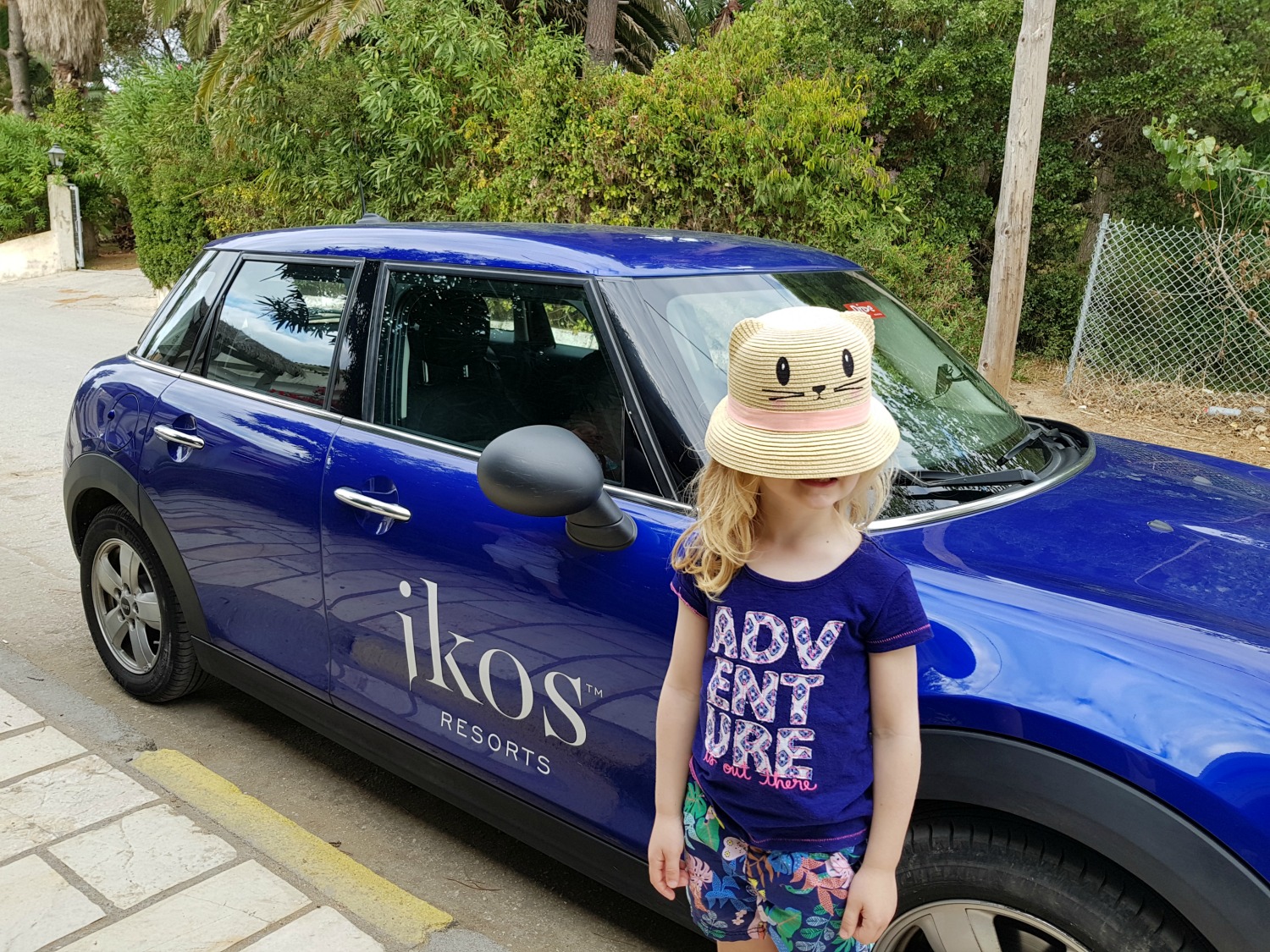 My daughter next to our blue Ikos Dassia mini - one day in Corfu exploring some of the island