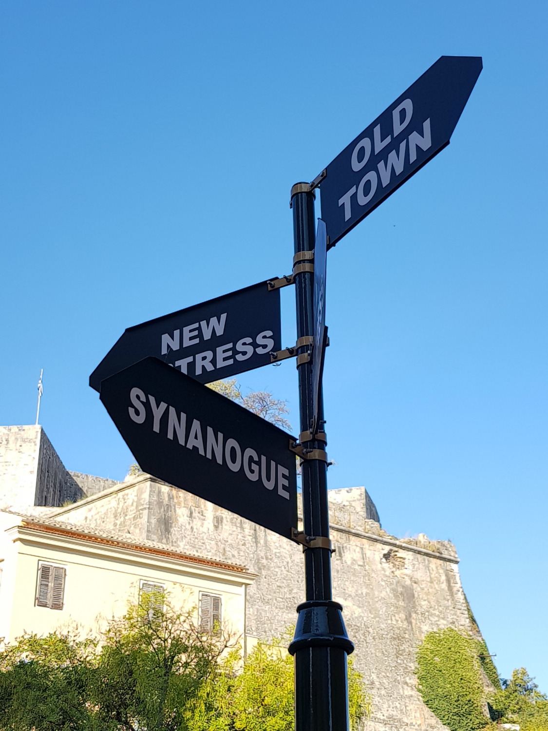 A signpost to the synagogue in Corfu Town - exploring its history is one of my three things to do in Corfu Town with kids