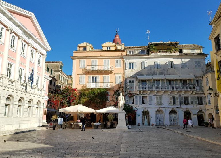 A square with its pastel buildings in Corfu Town - three things to do in Corfu Town with kids