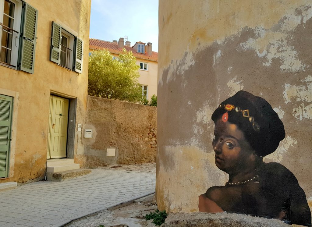 Street art on the side of a building in the citadel at Calvi in Corsica - my Corsica short break visiting Bastia and Calvi in a long weekend