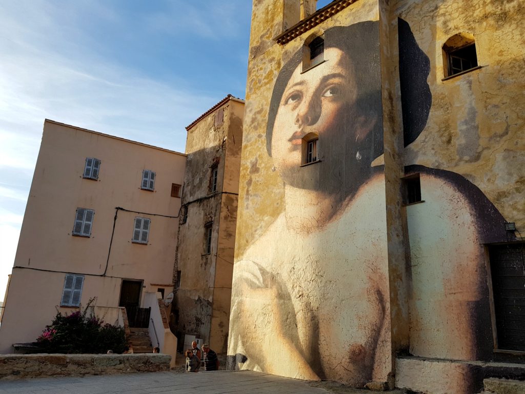 Street art on the side of the cathedral at Calvi in Corsica - my Corsica short break visiting Bastia and Calvi in a long weekend