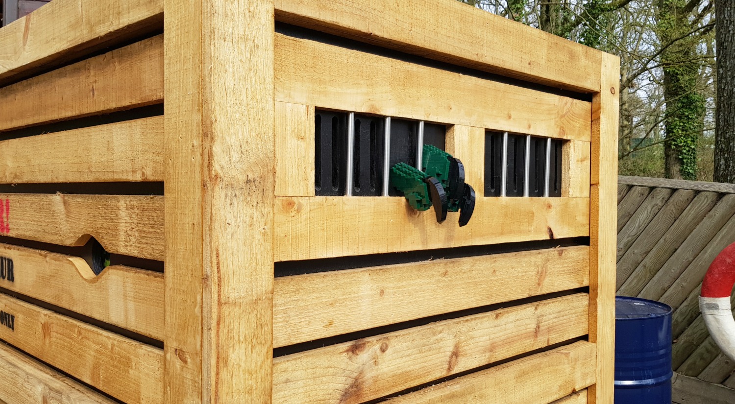 Lego claw poking out of a packing crate - one of the Brickosaurs at Marwell Zoo in Hampshire