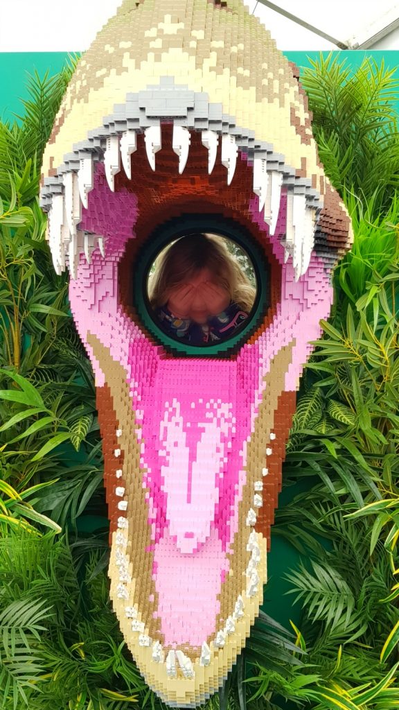 My daughter poses with her head inside a Megalosaur's mouth - one of the added bonuses to the trail at Marwell Zoo