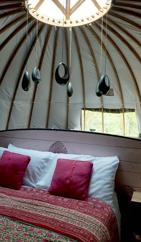View of the tealight candelabra over the bed in our tent at Penhein luxury glamping