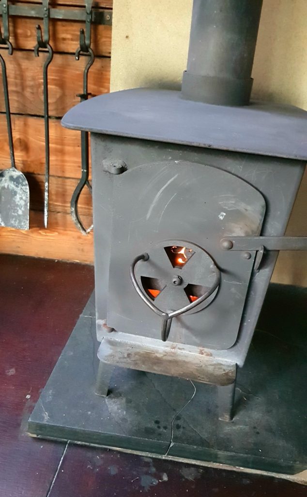 Fire burning in our woodburning stove - my Penhein glamping review