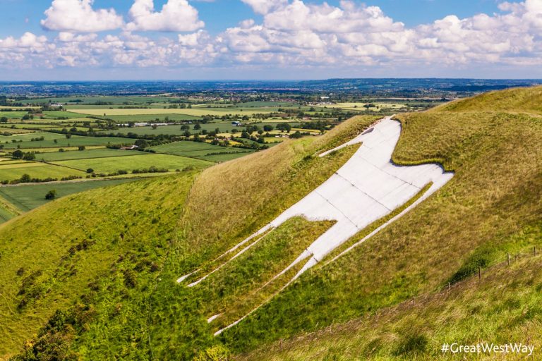The White Horse below Bratton Camp, an Iron Age hillfort near Westbury in Wiltshire - the Wiltshire white horses are one of the many sights to stop while exploring the Great West Way with kids
