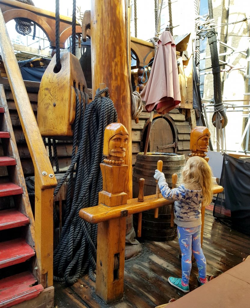 My daughter exploring the Golden Hinde in London, a replica of Sir Francis Drake's ship