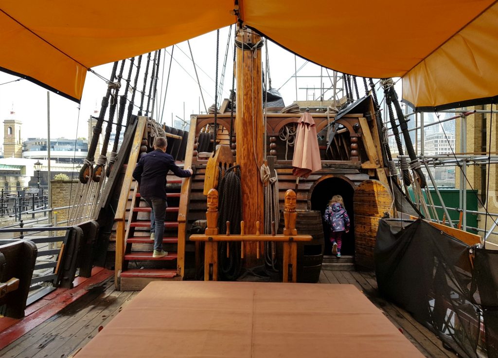 My daughter and husband climb the stairs to the upper deck of the Golden Hinde
