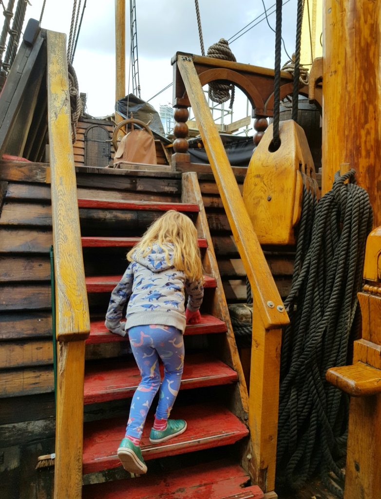 My daughter climbing to one of the upper decks on the Golden Hinde in London, a replica of Sir Francis Drake's ship