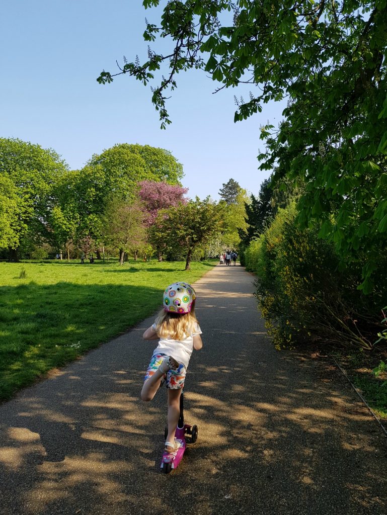 My daughter balancing with one leg in the air on her scooter - is a two wheel scooter or a three wheel scooter better for kids?