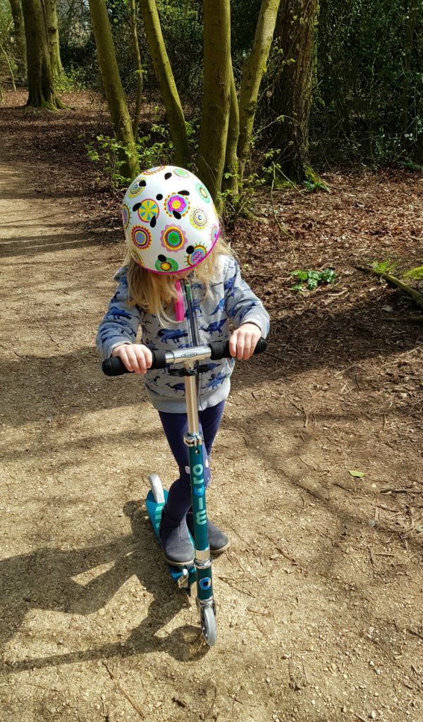 My daughter scoots on her Micro Sprite scooter