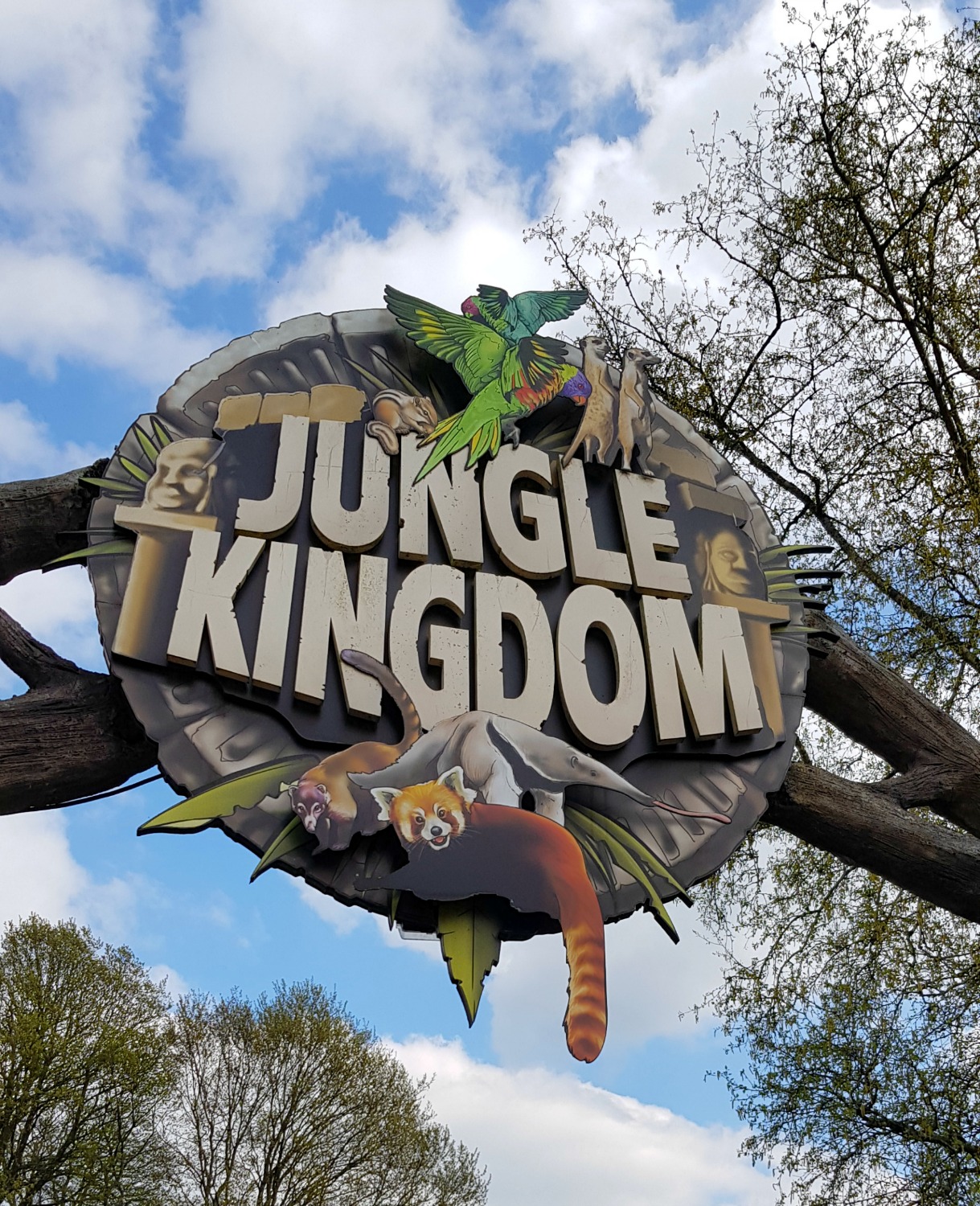 Sign for Jungle Kingdom against a blue sky at Longleat Safari park, near the new Koala Creek at Longleat enclosure